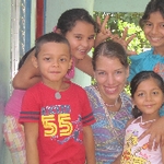 Volunteer surrounded with children